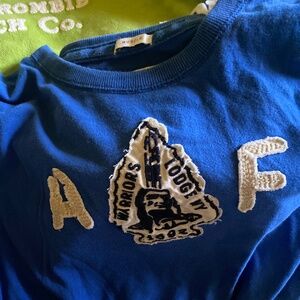 Abercrombie and Fitch vintage pull over and assorted men’s tshirts.